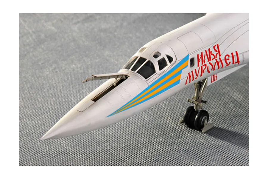 Close-up of the nose section of a finished 1/72 scale plastic model of a Tu-160 Blackjack bomber, showing cockpit, refueling probe, and Cyrillic markings.