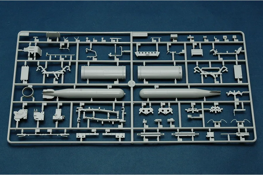 A grey plastic sprue from a Trumpeter 1/32 scale TBM-3 Avenger model kit, featuring various aircraft parts including torpedoes and structural components.