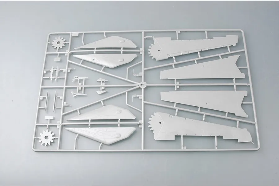 A grey plastic model kit sprue containing aircraft wing components and gear mechanisms for a Trumpeter 1/48 scale model.