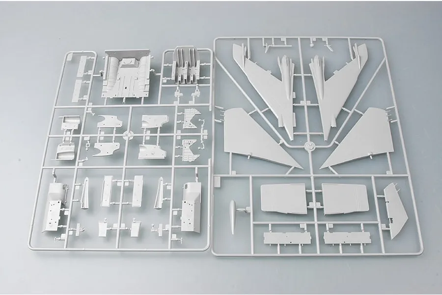 Two grey plastic model kit sprues containing various aircraft parts for a 1/48 scale Su-24M Fencer-D model.
