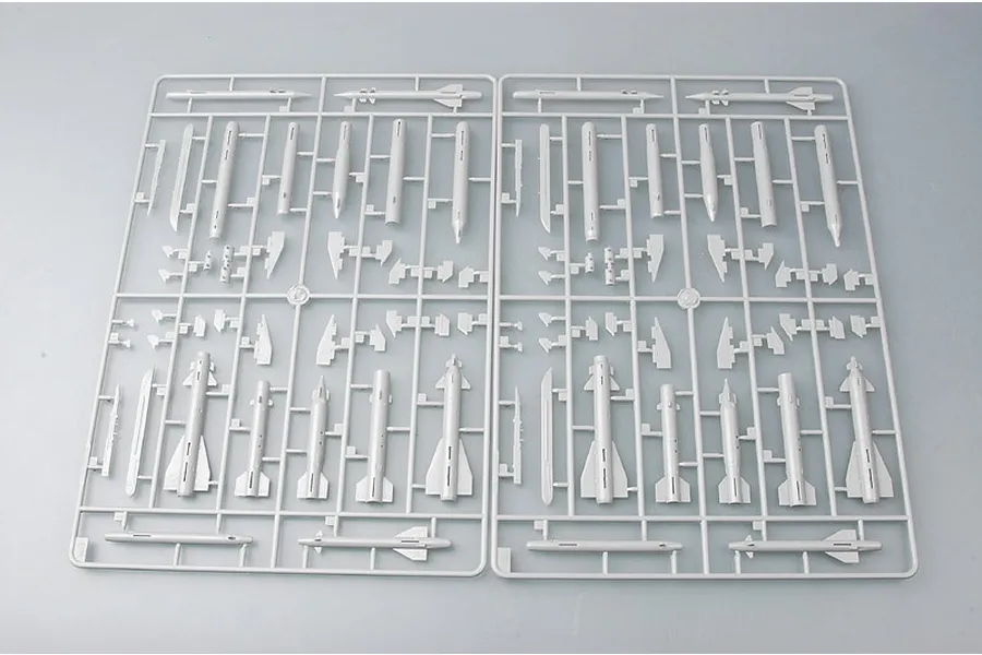 Two identical grey plastic model kit sprues featuring various missile and weapon components for a 1/48 scale aircraft model.