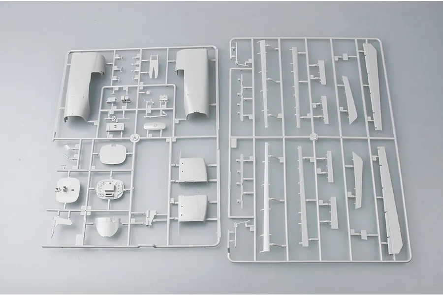 Two grey plastic model kit sprues containing various aircraft parts for a Trumpeter 1/48 scale Su-24M model kit.