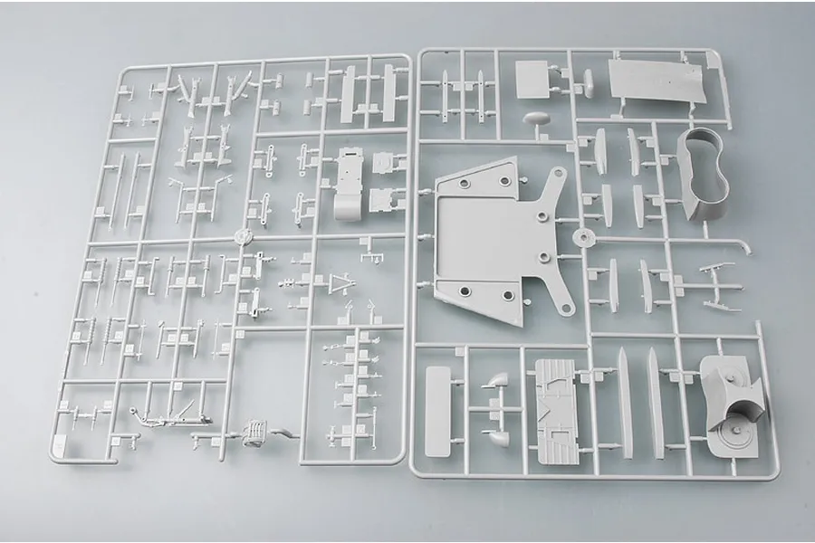 Two grey plastic model kit sprues containing various aircraft parts for a 1/48 scale model.