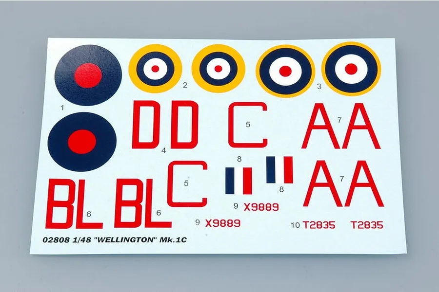 A decal sheet for a 1/48 scale Trumpeter Wellington Mk. IC model kit, featuring RAF roundels, red lettering, and serial numbers on a white backing sheet.