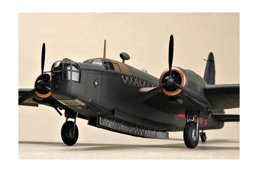 A completed 1/48 scale plastic model of a British Vickers Wellington Mk. IC bomber, showing the front fuselage, twin engines, and landing gear.