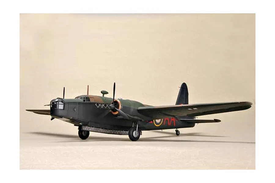 A completed 1/48 scale plastic model kit of a British Wellington Mk. IC bomber, painted in dark green and brown camouflage with RAF markings.