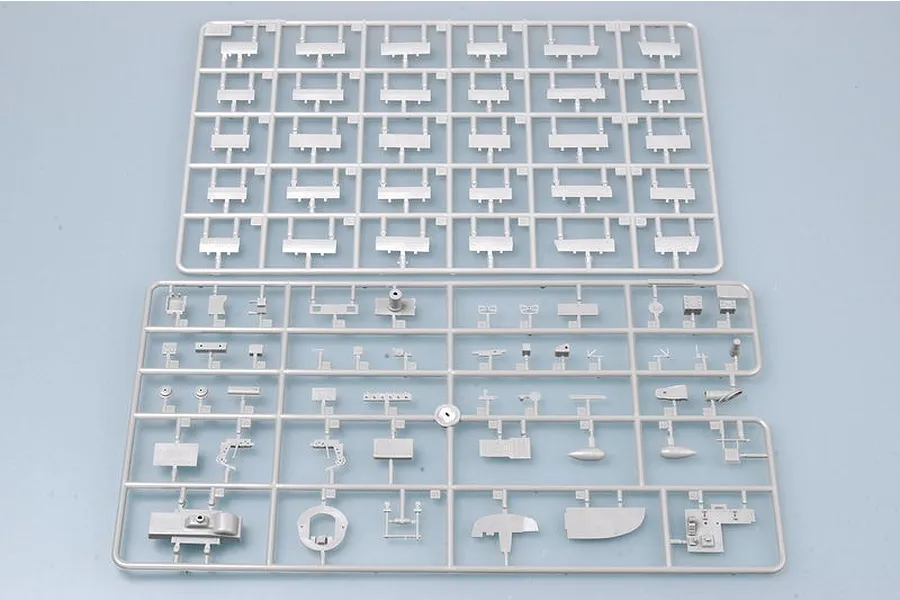 Two grey plastic model kit sprues containing various aircraft parts for a Trumpeter 1/48 Wellington Mk. IC model kit.