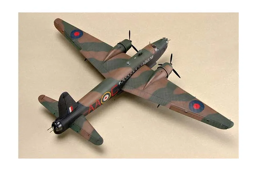 A high-angle view of a completed 1/48 scale plastic model of a British Vickers Wellington bomber with green and brown camouflage.
