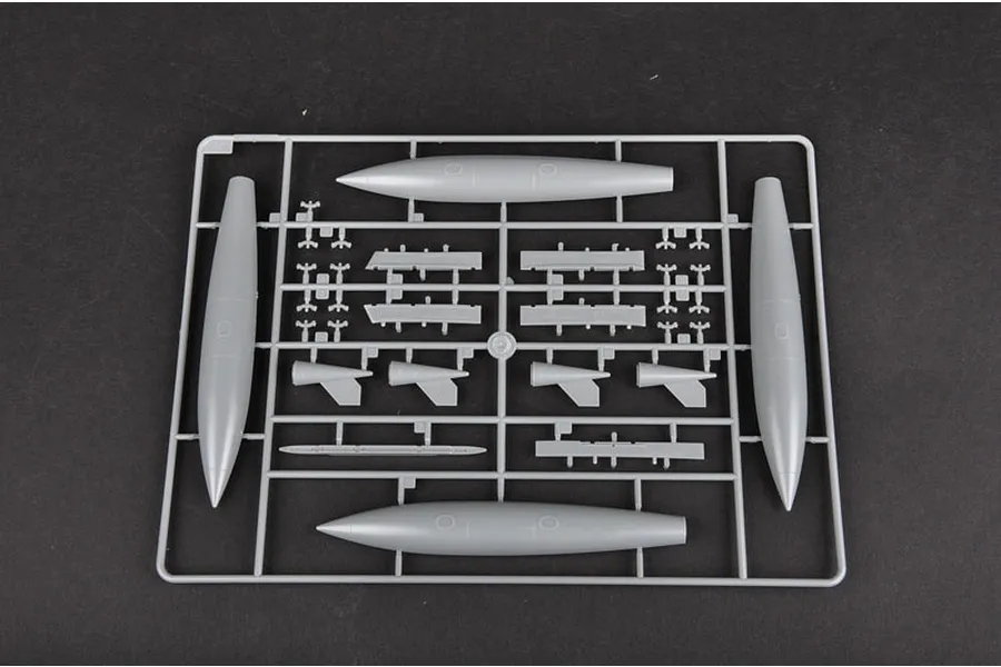 A grey plastic sprue from a Trumpeter 1/32 A-4M Skyhawk model kit featuring external fuel tanks and small aircraft components.