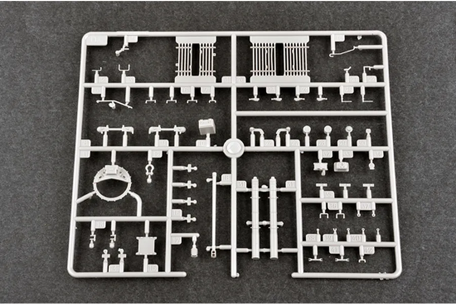A grey plastic model kit sprue labeled D, containing various small tank parts for a 1/35 scale model.