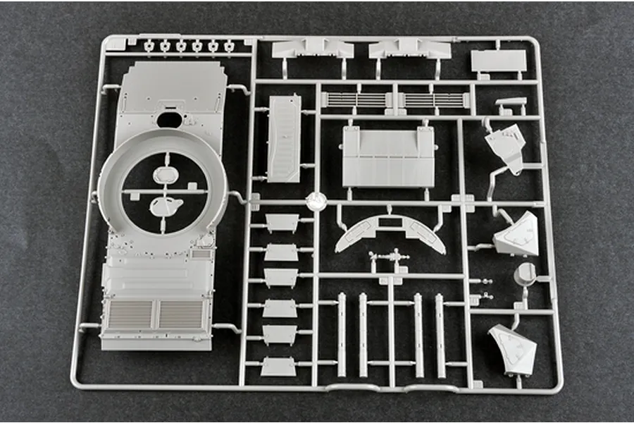 A grey plastic sprue containing various parts for a 1/35 scale military model kit, including a large tank hull section.