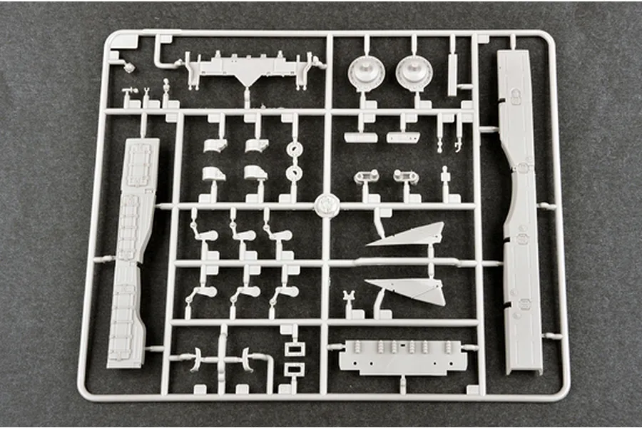 A grey plastic sprue containing various unpainted model tank parts for a 1/35 scale military vehicle kit.
