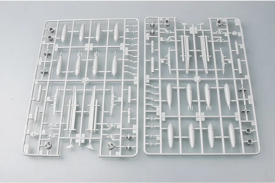 Two grey plastic model kit sprues containing various bomb and ordnance parts for a 1/32 scale Fairey Swordfish model.