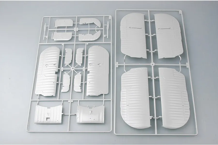 Two grey plastic model kit sprues containing wing and control surface parts for a 1/32 scale Fairey Swordfish aircraft model.