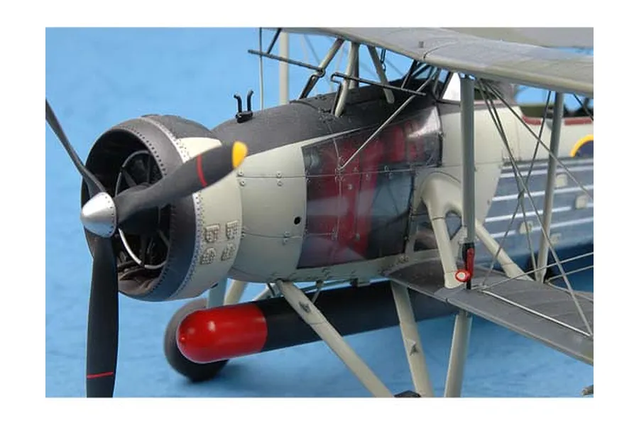 Close-up of a 1/32 scale Fairey Swordfish model aircraft showing the engine cowling, propeller, and torpedo.