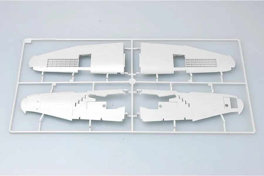 A grey plastic model aircraft wing sprue from a Trumpeter 1/32 P-47 Thunderbolt kit, showing four wing sections attached to a frame.