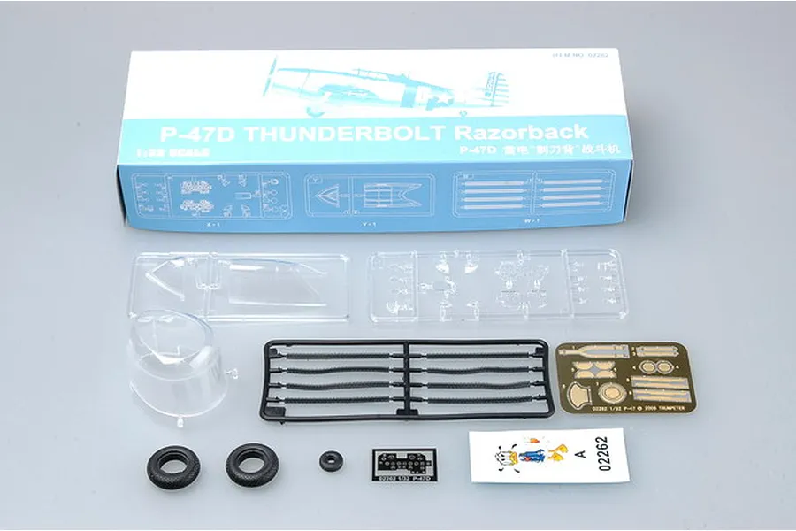 Trumpeter 1/32 scale P-47D Thunderbolt Razorback model kit box with included plastic sprues, clear parts, rubber tires, photo-etched parts, and decals.
