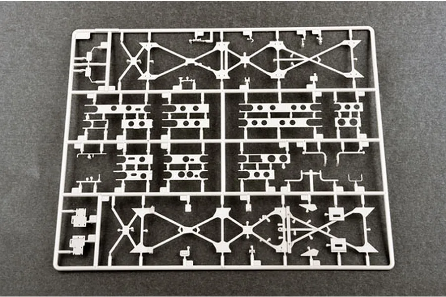 A grey plastic model kit sprue containing various structural components for a military vehicle model.