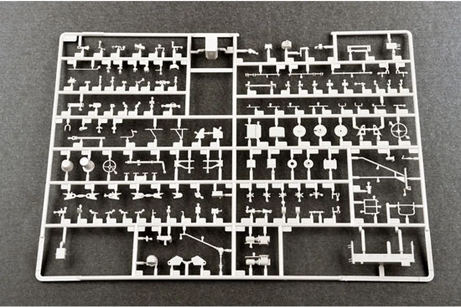A grey plastic model kit sprue containing numerous small, intricate parts for a 1/35 scale military vehicle model.
