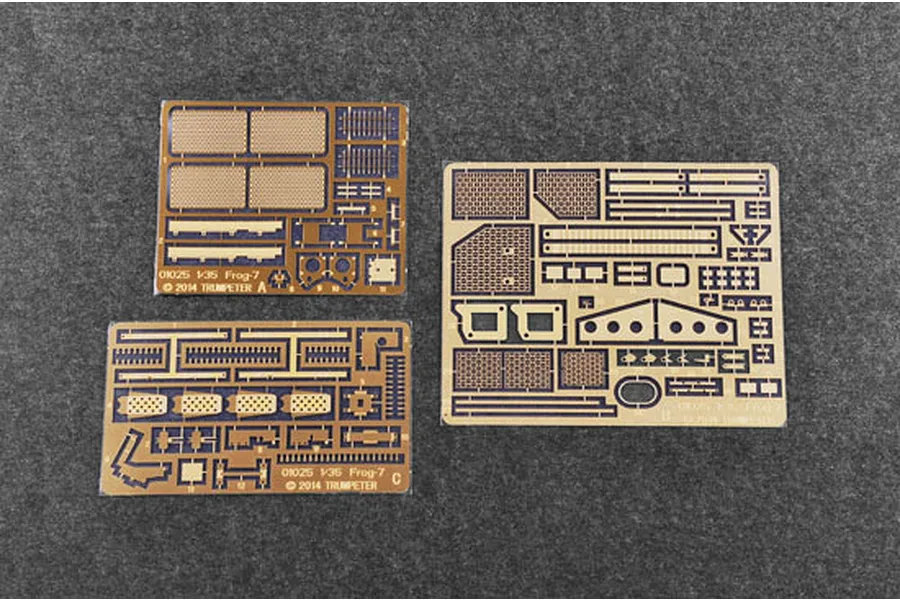 Three photo-etched metal detail sheets for a 1/35 scale Trumpeter model kit on a grey felt background.