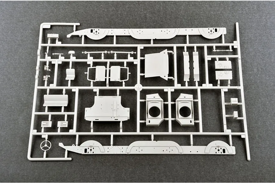 A light grey plastic model kit sprue containing various vehicle parts for a 1/35 scale military model.