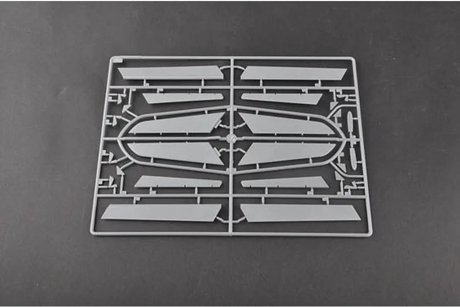 A grey plastic model kit sprue containing various flat wing or control surface components for a 1/48 scale aircraft model.
