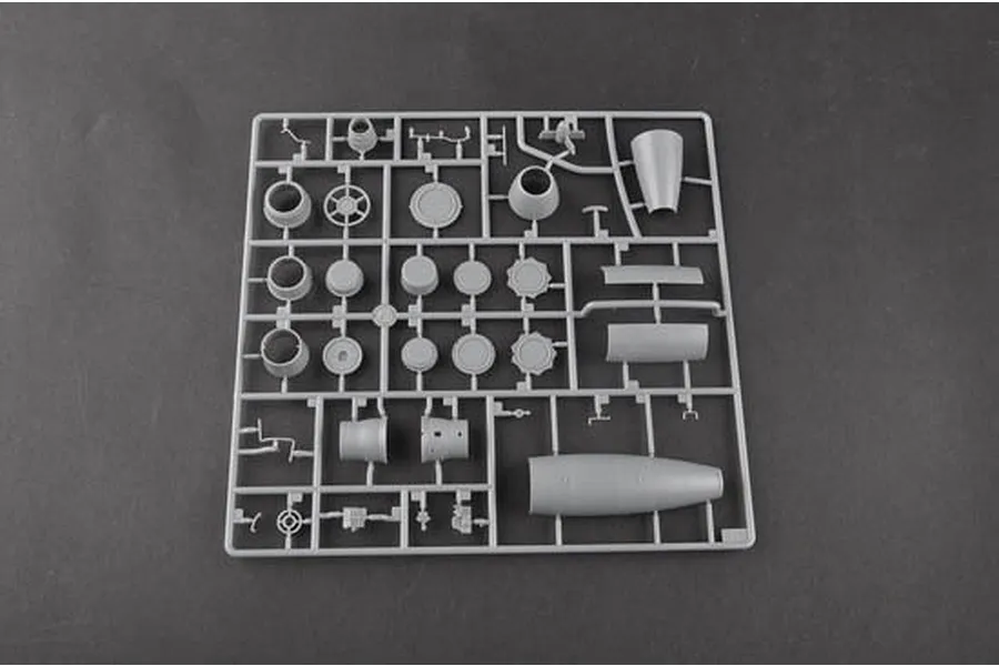 A grey plastic sprue containing various engine and fuselage components for a 1/48 scale model aircraft kit.