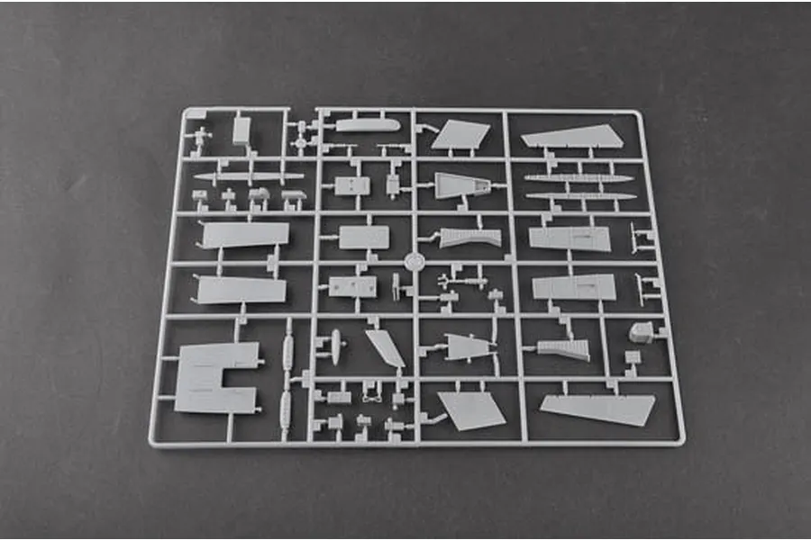 A grey plastic sprue containing various unpainted model aircraft parts for a Trumpeter 1/48 scale kit.