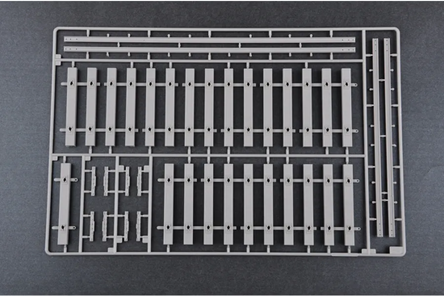 A grey plastic model kit sprue containing railway track sections for a 1/35 scale armoured train model.
