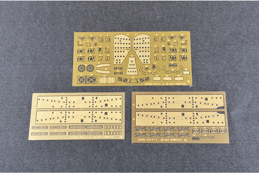 Three photo-etched brass sheets for a 1/48 scale model kit, featuring various small aircraft parts and structural components.