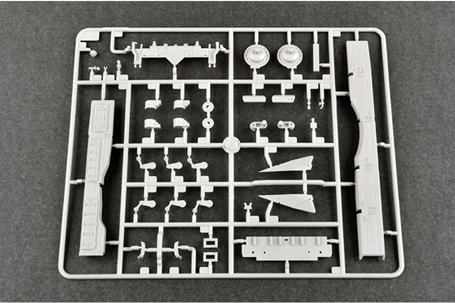 A grey plastic sprue containing various unpainted model tank parts for a 1/35 scale Trumpeter T-72B3M model kit.