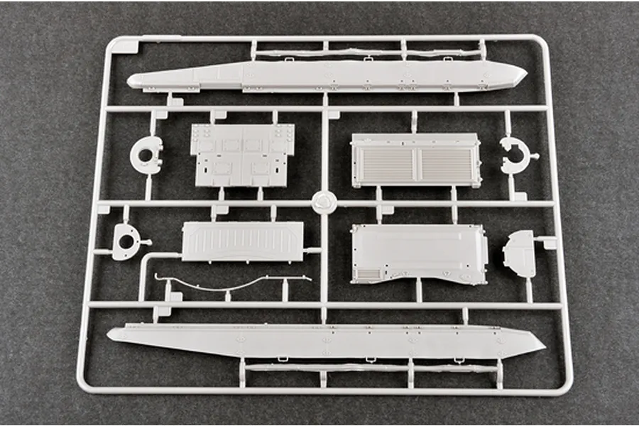 A grey plastic sprue containing various tank hull and panel parts for a 1/35 scale model kit.