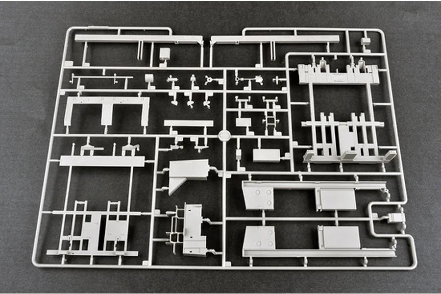A grey plastic sprue containing various unpainted model parts for a 1/35 scale military vehicle kit.