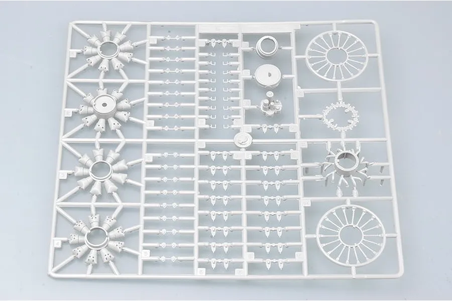 A grey plastic sprue containing various aircraft engine parts for a 1/32 scale model kit.