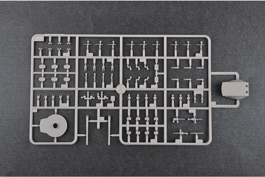 A grey plastic sprue containing various small model parts for a 1/350 scale battleship kit, set against a dark grey background.