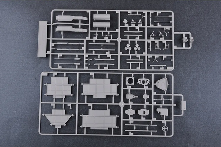Two grey plastic model kit sprues containing various ship parts for a 1/350 scale battleship model, laid out on a dark grey surface.