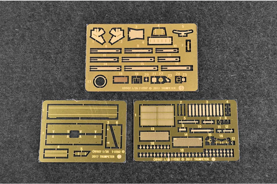 Three photo-etched brass detail sheets for a 1/35 scale Trumpeter T-72B2 model tank kit, laid out on a dark grey felt surface.
