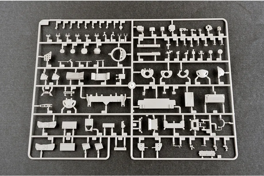 A grey plastic model kit sprue containing various small tank parts for a 1/35 scale model.