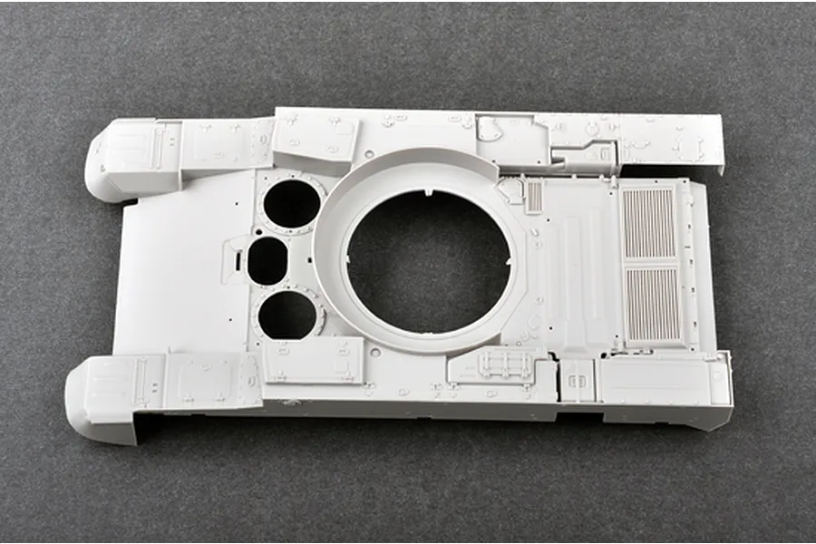 Top-down view of an unpainted light grey plastic tank hull model part from a Trumpeter 1/35 scale kit.