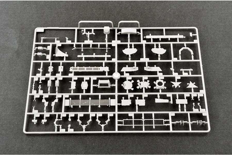 A grey plastic sprue containing various small model parts for a 1/35 scale military vehicle kit.