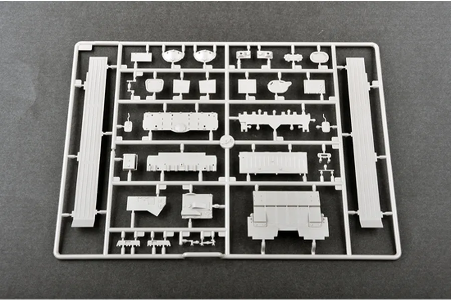A grey plastic sprue containing various unpainted model tank parts for a 1/35 scale military vehicle kit.