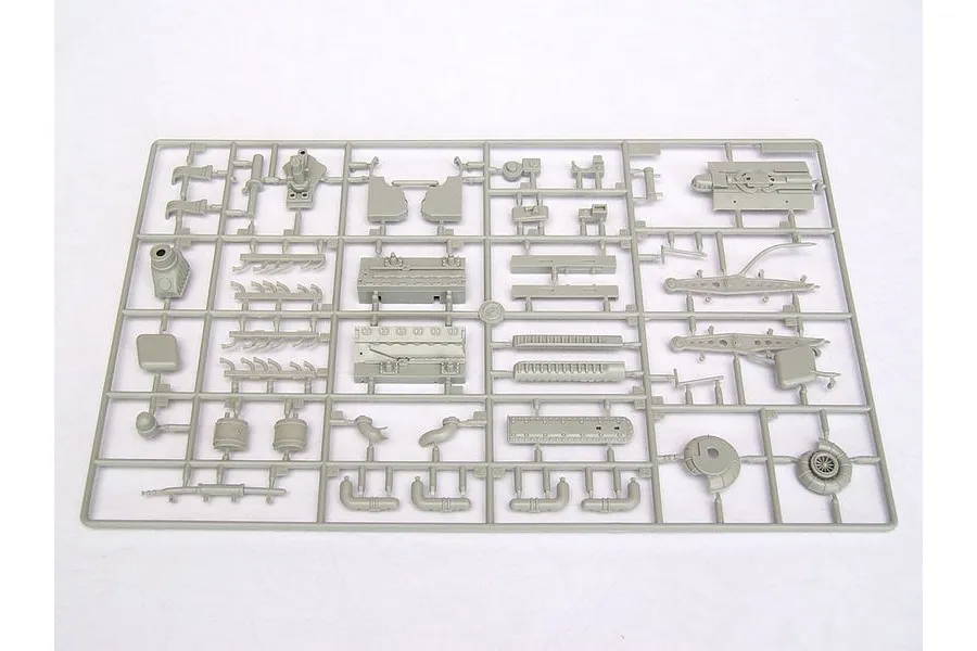 A grey plastic sprue containing various model aircraft engine and structural parts for a 1/24 scale model kit.