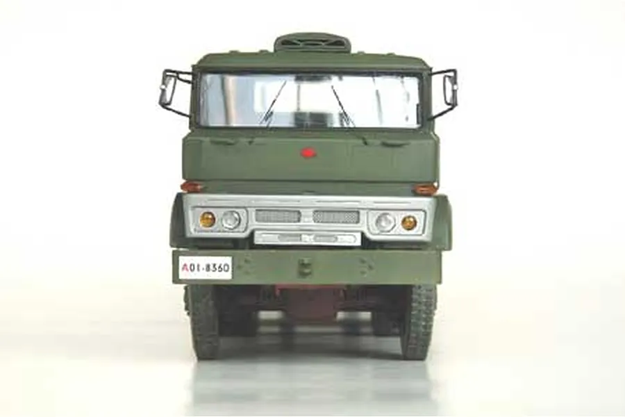 Front view of a 1/35 scale Chinese military tank transporter truck model in olive green.