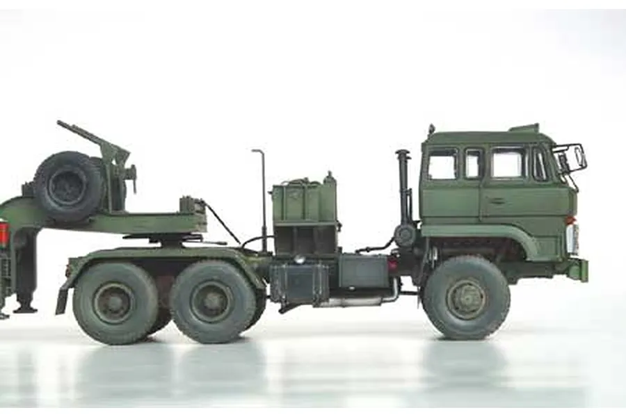 Side view of a 1/35 scale Chinese 50 Ton Tank Transporter truck model kit painted in olive green.