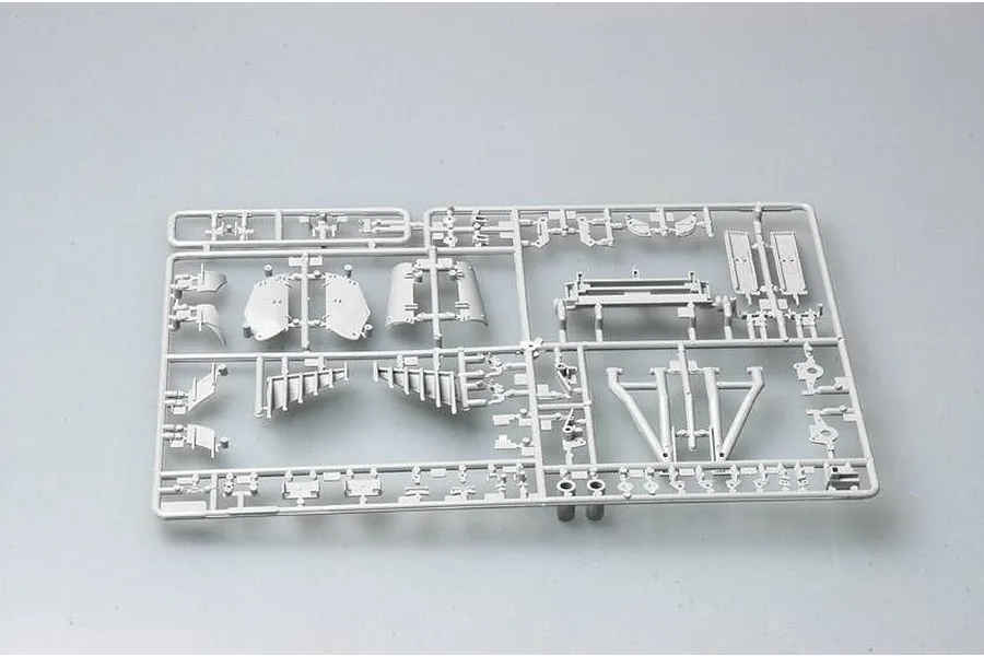 A grey plastic sprue containing various unpainted model tank parts for a 1/35 scale military model kit.