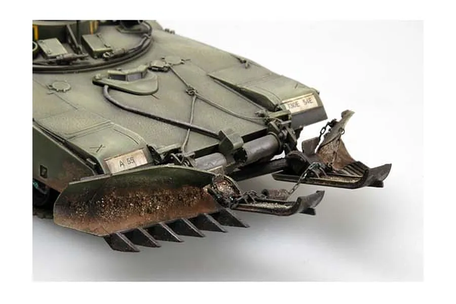 Close-up of a 1/35 scale model tank front hull with a mine plow attachment, featuring weathered olive green paint and realistic metal textures.