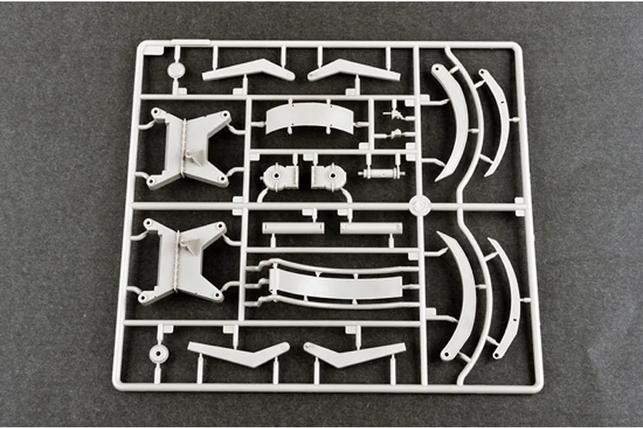 A grey plastic model kit sprue containing various structural parts for a 1/35 scale BTM-3 trench digger vehicle model.