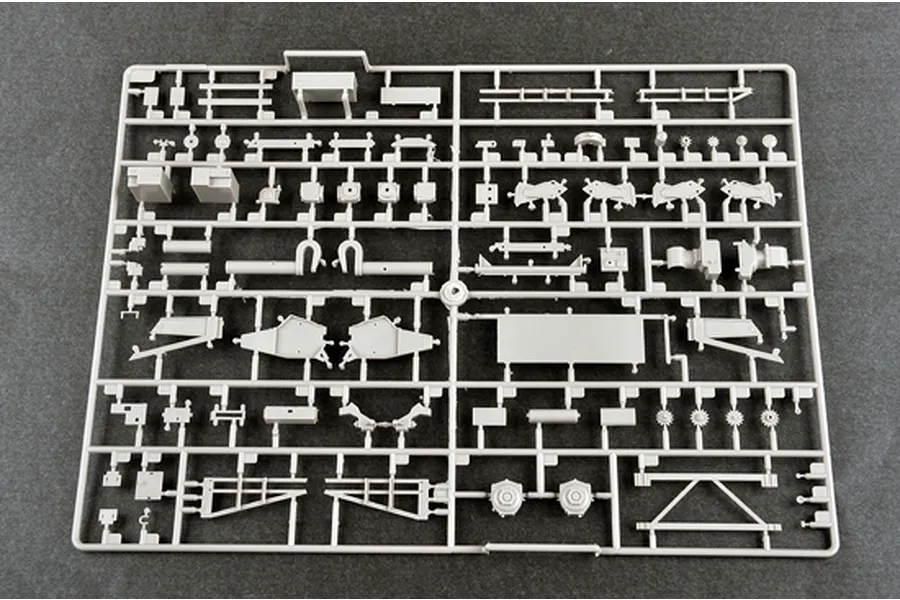 A grey plastic sprue containing various unpainted model parts for the Trumpeter 1/35 BTM-3 trench digger kit.