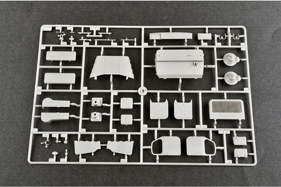 A grey plastic sprue containing various unpainted model parts for the Trumpeter 1/35 BTM-3 High Speed Trench Digger kit.