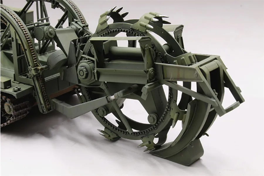 A close-up view of the large rotating digging wheel assembly on a 1/35 scale Trumpeter BTM-3 trench digger model kit.